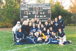 Katie Wilkin (in yellow and black jersey) celebrates Lawrence's victory in the 2001 Midwest Conference Tournament Championship Game.