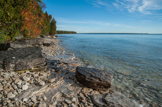 A photo of Lake Michigan shoreline at Björklunden in the summer.