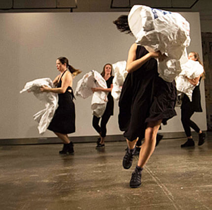 Four members of the Wild Space Dance Company performing a dance from the program Caught Up in the Moment.