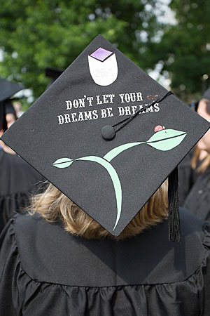A graduation mortar board with the message Don't let your dreams be dreams 