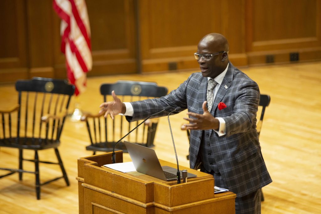 Dr. Eddie Moore Jr. speaks at podium.