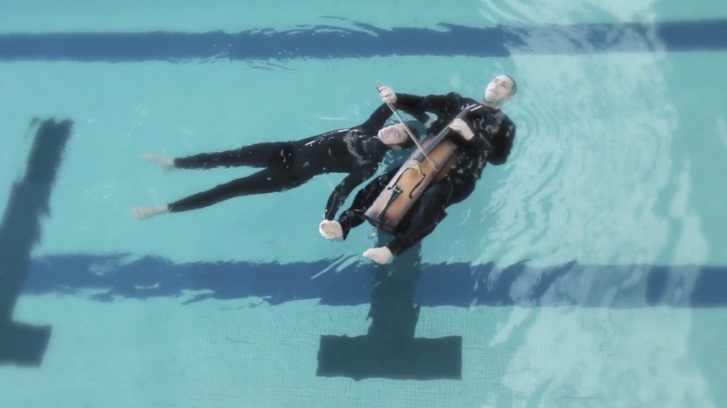 Gabriel Forestieri and Loren Kiyoshi Dempster float in the water while performing "Breathe."