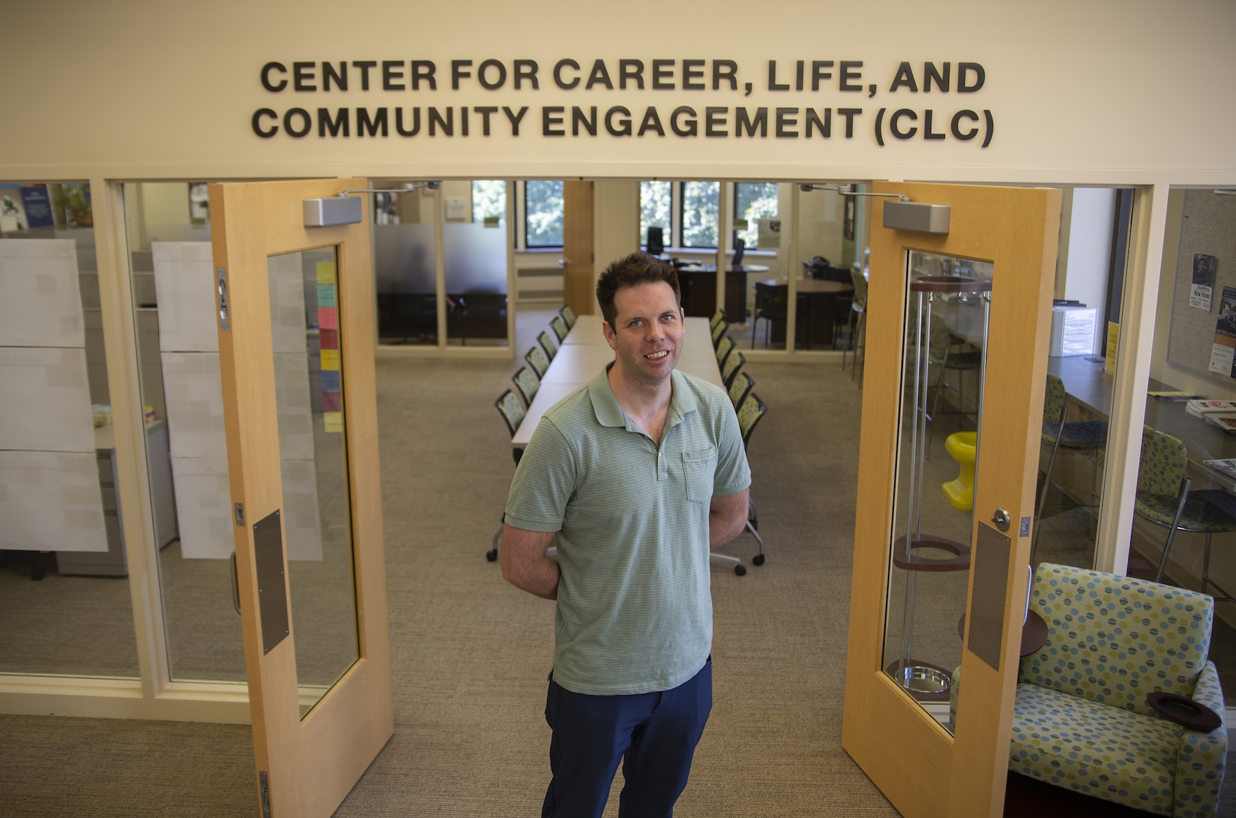 Mike O'Connor poses for a photo in the doorway to the Center for Career, Life and Community Engagement. 