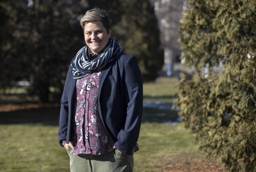 Katie Schweighofer poses for a photo on Main Hall Green.